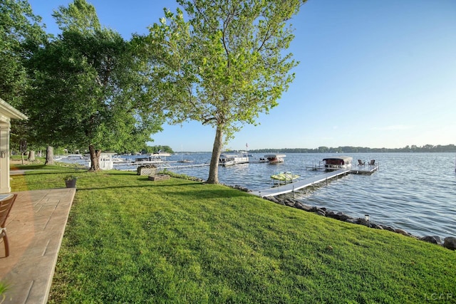 4078 Woodland Ave, Manitou Beach, MI 49253 - dock area with a water view and a yard