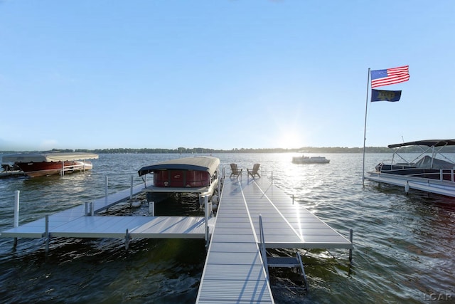 4078 Woodland Ave, Manitou Beach, MI 49253 - dock featuring a water view and boat lift