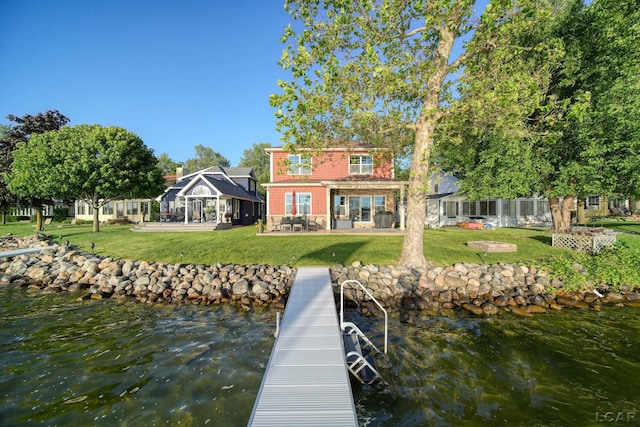 4078 Woodland Ave, Manitou Beach, MI 49253 - dock area with a patio, a yard, and a water view