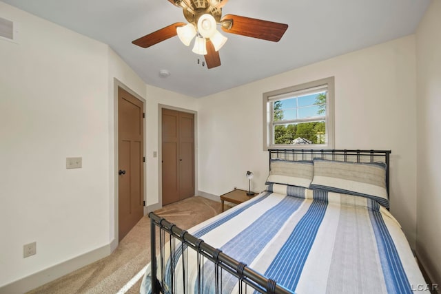 4078 Woodland Ave, Manitou Beach, MI 49253 - carpeted bedroom featuring ceiling fan and a closet