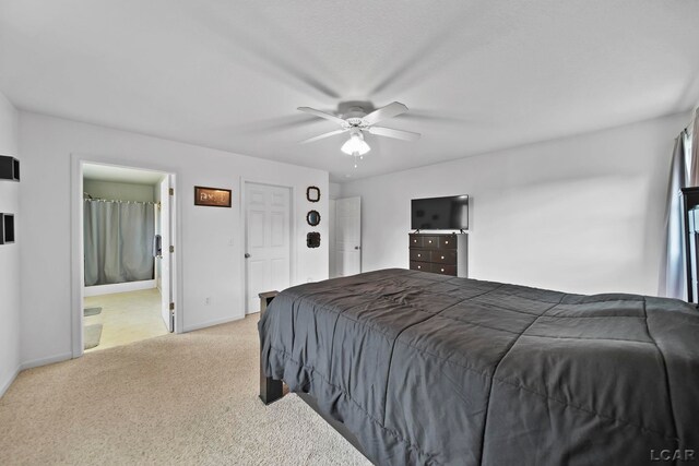 2099 Friar Tuck Cir, Adrian, MI 49221 - bedroom featuring light colored carpet, ceiling fan, and ensuite bath