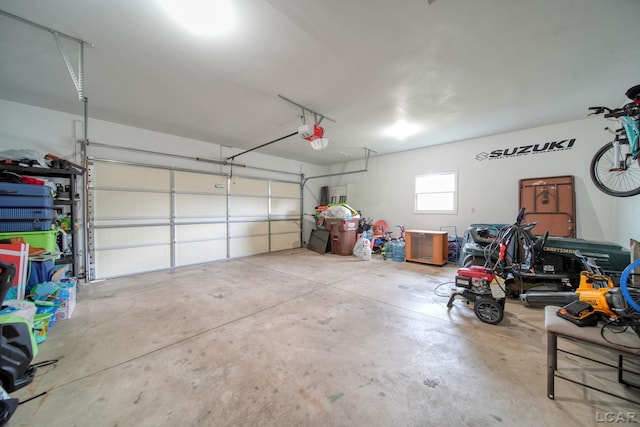 2099 Friar Tuck Cir, Adrian, MI 49221 - garage with a garage door opener