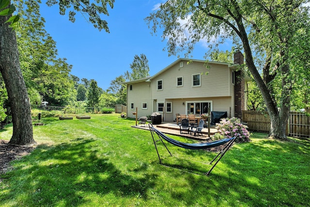 2211 Skyline Dr NW, Grand Rapids, MI 49504 - back of house with a chimney and a patio area