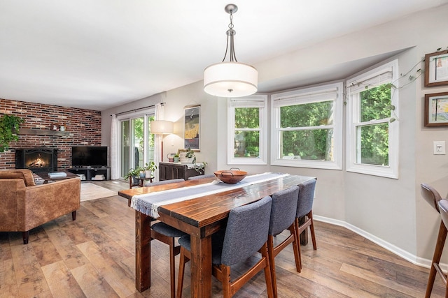 2211 Skyline Dr NW, Grand Rapids, MI 49504 - dining room with light wood-style flooring and baseboards