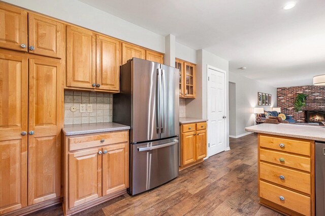 2211 Skyline Dr NW, Grand Rapids, MI 49504 - kitchen with freestanding refrigerator, tasteful backsplash, open floor plan, light countertops, and recessed lighting