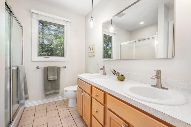 2211 Skyline Dr NW, Grand Rapids, MI 49504 - full bath with a shower stall, plenty of natural light, double vanity, and tile patterned flooring