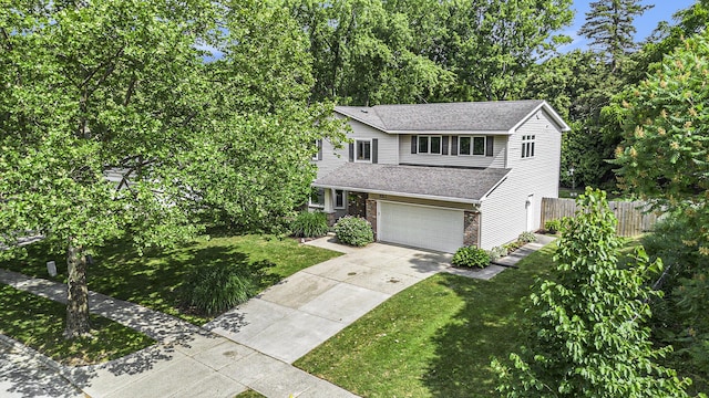 2211 Skyline Dr NW, Grand Rapids, MI 49504 - view of front of property with driveway, an attached garage, and a shingled roof