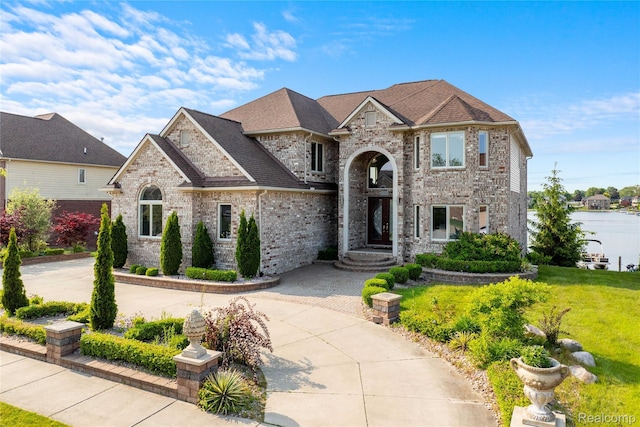 4303 S Lake Ln, Shelby Twp, MI 48316 - french provincial home with brick siding and a front yard