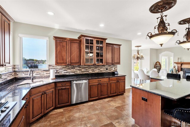 4303 S Lake Ln, Shelby Twp, MI 48316 - kitchen featuring appliances with stainless steel finishes, a kitchen bar, decorative backsplash, glass insert cabinets, and recessed lighting