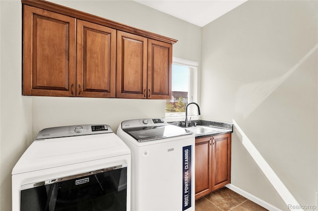 4303 S Lake Ln, Shelby Twp, MI 48316 - laundry room with cabinet space, washing machine and dryer, and dark tile patterned floors
