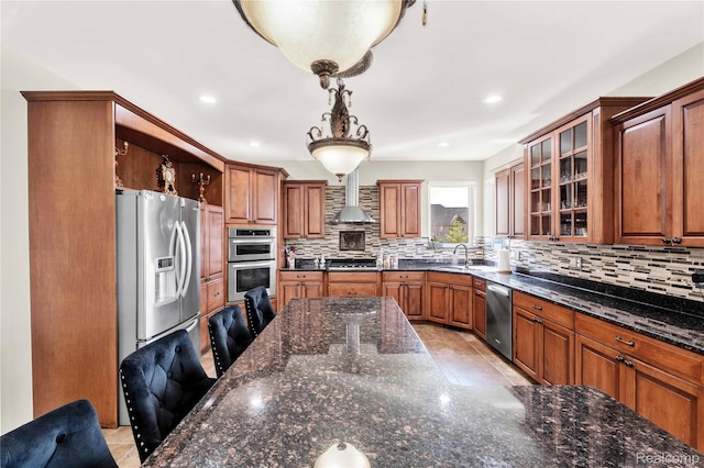 4303 S Lake Ln, Shelby Twp, MI 48316 - kitchen with stainless steel appliances, decorative backsplash, brown cabinetry, glass insert cabinets, and recessed lighting