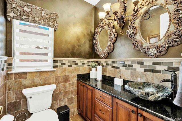4303 S Lake Ln, Shelby Twp, MI 48316 - bathroom featuring vanity, tile walls, and wainscoting
