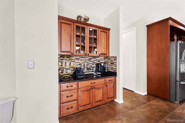 4303 S Lake Ln, Shelby Twp, MI 48316 - bar area with stainless steel refrigerator with ice dispenser, backsplash, and dark tile patterned floors