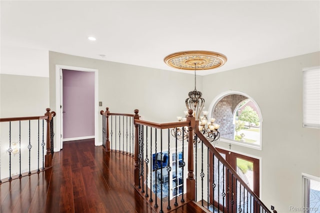 4303 S Lake Ln, Shelby Twp, MI 48316 - hallway with a chandelier, an upstairs landing, wood-type flooring, and recessed lighting