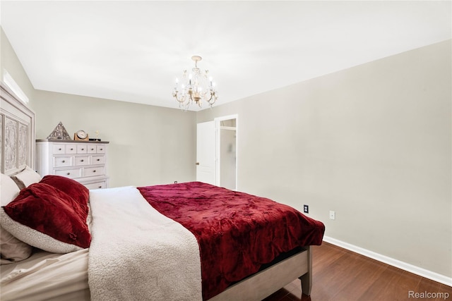 4303 S Lake Ln, Shelby Twp, MI 48316 - bedroom featuring wood finished floors and a chandelier