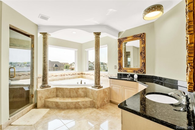 4303 S Lake Ln, Shelby Twp, MI 48316 - bathroom featuring decorative columns, vanity, a garden tub, and a stall shower