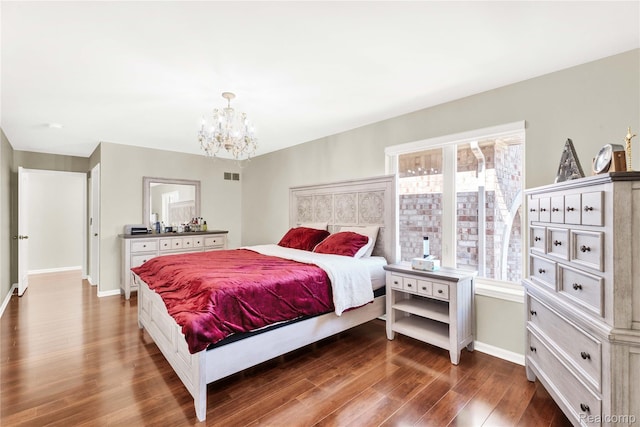 4303 S Lake Ln, Shelby Twp, MI 48316 - bedroom with dark wood-type flooring and a chandelier