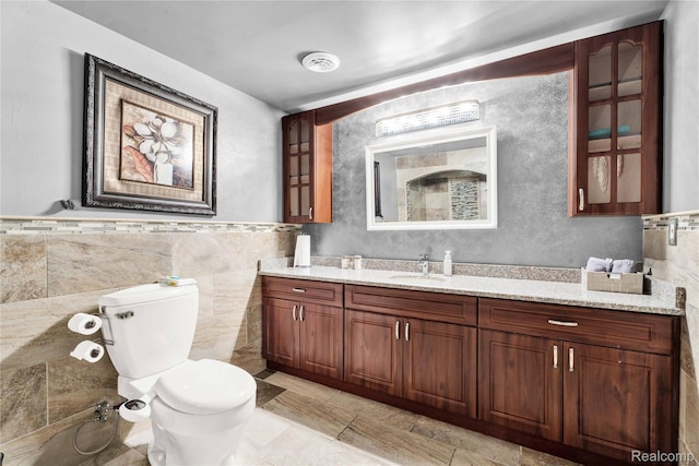 4303 S Lake Ln, Shelby Twp, MI 48316 - bathroom with vanity and tile walls