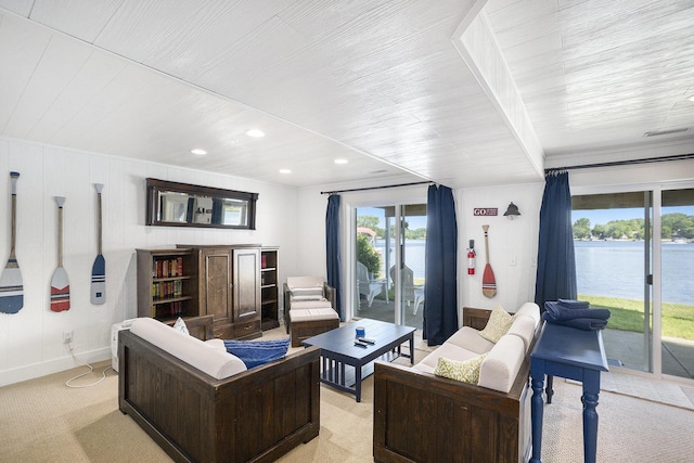 10520 Maple Xing, Canadian Lakes, MI 49346 - living room with recessed lighting, wooden ceiling, a water view, and light colored carpet