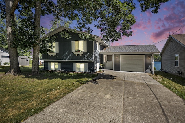 10520 Maple Xing, Canadian Lakes, MI 49346 - tri-level home with an attached garage, driveway, and a front lawn