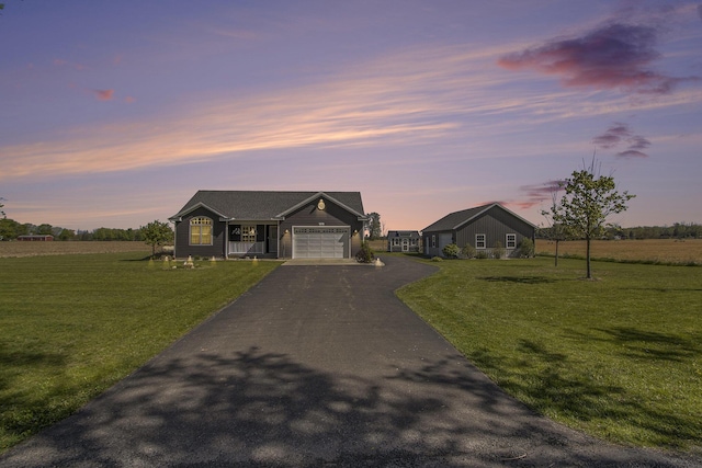 9733 E O Ave, Kalamazoo, MI 49048 - ranch-style home featuring driveway, an attached garage, and a front lawn