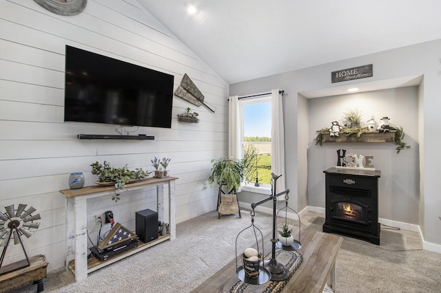9733 E O Ave, Kalamazoo, MI 49048 - living room featuring lofted ceiling, wooden walls, and carpet
