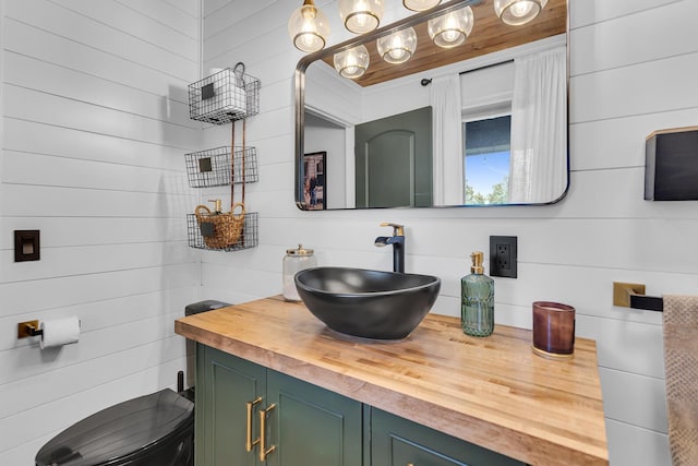13451 S Waldron Rd, Waldron, MI 49288 - bathroom with vanity and wood walls