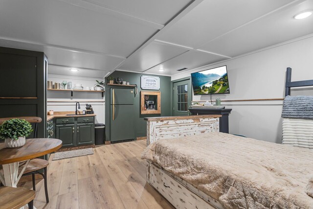 13451 S Waldron Rd, Waldron, MI 49288 - bedroom featuring freestanding refrigerator, light wood-type flooring, and recessed lighting