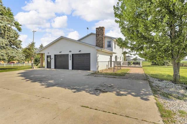 13451 S Waldron Rd, Waldron, MI 49288 - view of side of home with a chimney and a garage