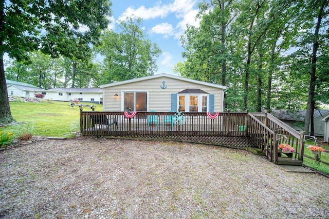 5390 Parkwood Ct, Manitou Beach, MI 49253 - view of front of house featuring a wooden deck and a front lawn