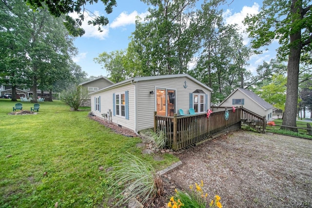 5390 Parkwood Ct, Manitou Beach, MI 49253 - view of front of home with a deck and a front yard