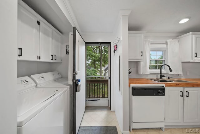 5390 Parkwood Ct, Manitou Beach, MI 49253 - laundry room with independent washer and dryer, healthy amount of natural light, crown molding, and light flooring