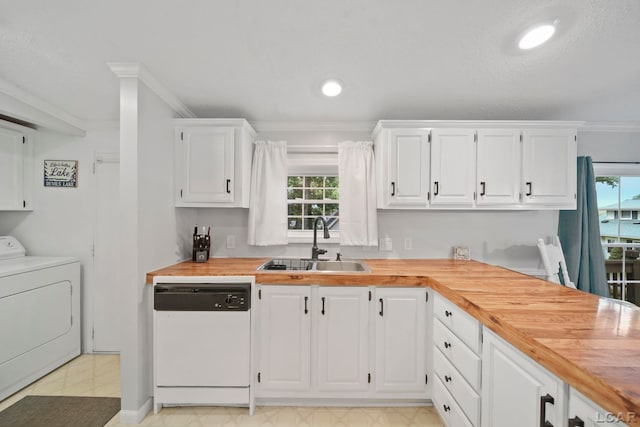 5390 Parkwood Ct, Manitou Beach, MI 49253 - kitchen with washer / dryer, white dishwasher, butcher block countertops, crown molding, and white cabinetry
