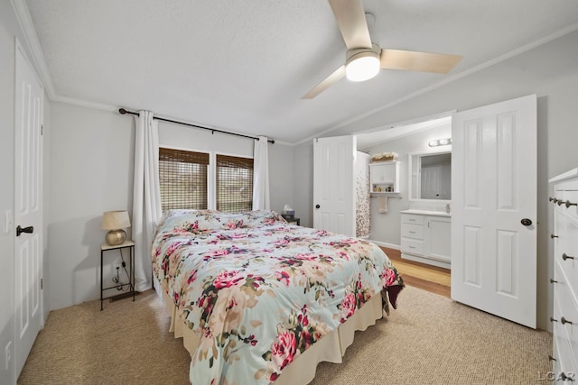5390 Parkwood Ct, Manitou Beach, MI 49253 - bedroom with vaulted ceiling, crown molding, ensuite bath, a ceiling fan, and light colored carpet