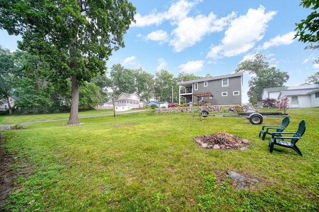 5390 Parkwood Ct, Manitou Beach, MI 49253 - view of grassy yard with a fire pit