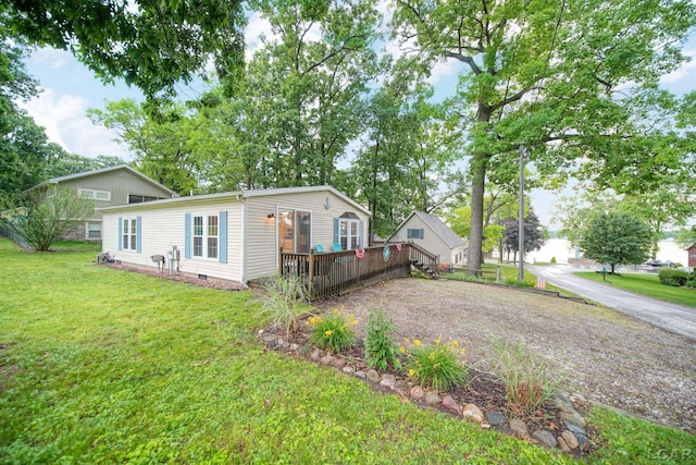 5390 Parkwood Ct, Manitou Beach, MI 49253 - view of front of property with a deck, a front yard, and crawl space