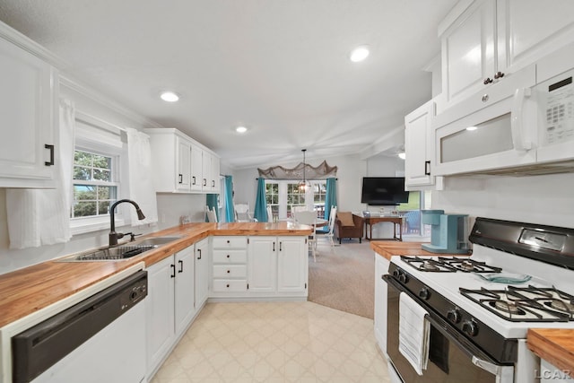 5390 Parkwood Ct, Manitou Beach, MI 49253 - kitchen with white appliances, butcher block counters, a peninsula, white cabinets, and light floors