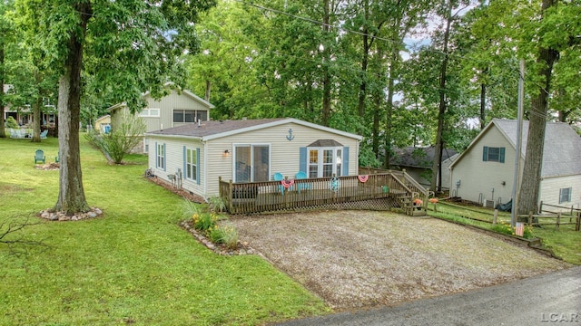 5390 Parkwood Ct, Manitou Beach, MI 49253 - view of front of property featuring a deck, french doors, and view of wooded area