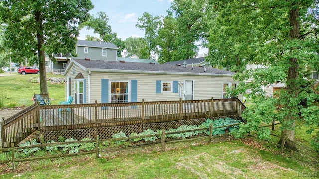 5390 Parkwood Ct, Manitou Beach, MI 49253 - rear view of property featuring a wooden deck and a lawn