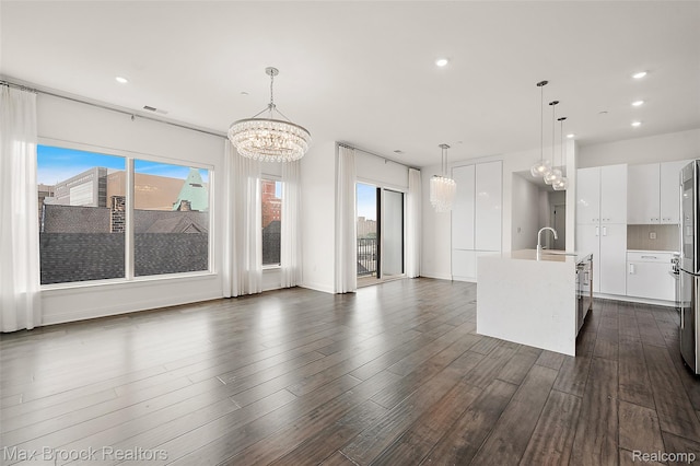 438 Selden St Unit 401, Detroit, MI 48201 - kitchen featuring a chandelier, white cabinets, plenty of natural light, light countertops, and recessed lighting