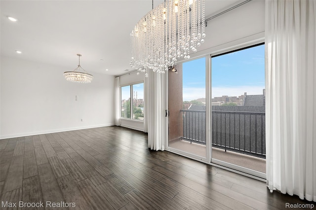 438 Selden St Unit 401, Detroit, MI 48201 - empty room with a chandelier, dark wood-style floors, and recessed lighting
