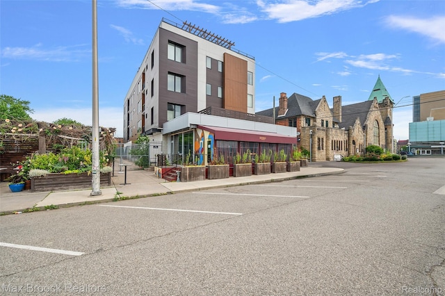 438 Selden St Unit 401, Detroit, MI 48201 - view of building exterior featuring uncovered parking