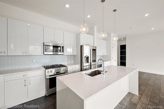 438 Selden St Unit 401, Detroit, MI 48201 - kitchen with appliances with stainless steel finishes, white cabinetry, dark wood-type flooring, backsplash, and recessed lighting