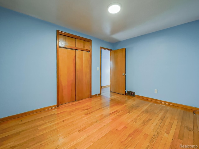 16039 Fordham St, Detroit, MI 48205 - unfurnished bedroom featuring light wood-style floors and a closet