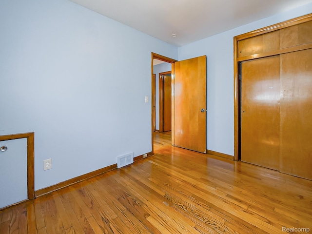 16039 Fordham St, Detroit, MI 48205 - unfurnished bedroom with light wood finished floors and a closet