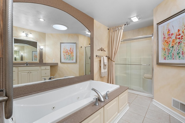 3229 Nighthawk Ln, Battle Creek, MI 49015 - full bath with a shower stall, tile patterned floors, a tub with jets, and vanity