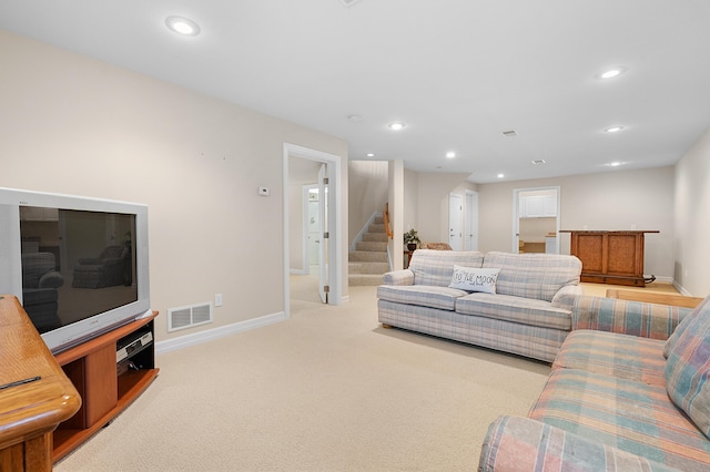 3229 Nighthawk Ln, Battle Creek, MI 49015 - living room featuring stairs, carpet, and recessed lighting