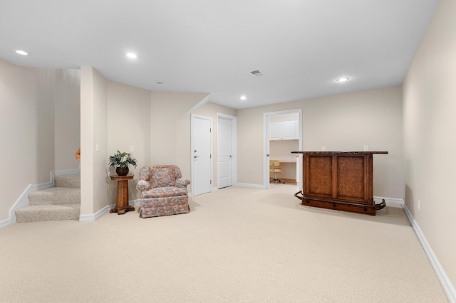 3229 Nighthawk Ln, Battle Creek, MI 49015 - living area featuring light carpet, stairway, and recessed lighting