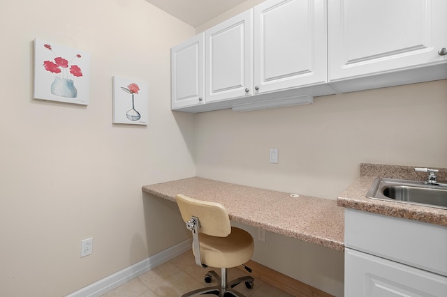 3229 Nighthawk Ln, Battle Creek, MI 49015 - home office with built in desk and light tile patterned flooring