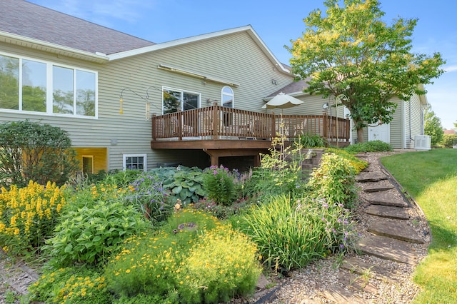 3229 Nighthawk Ln, Battle Creek, MI 49015 - back of property with a deck and roof with shingles